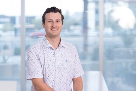 portrait of a smiling person in professional attire